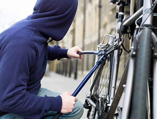 A thief stealing a bike